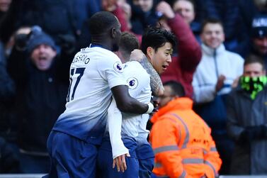 Son Heung-min, right, is mobbed by teammates after giving Tottenham the lead against Newcastle. Reuters