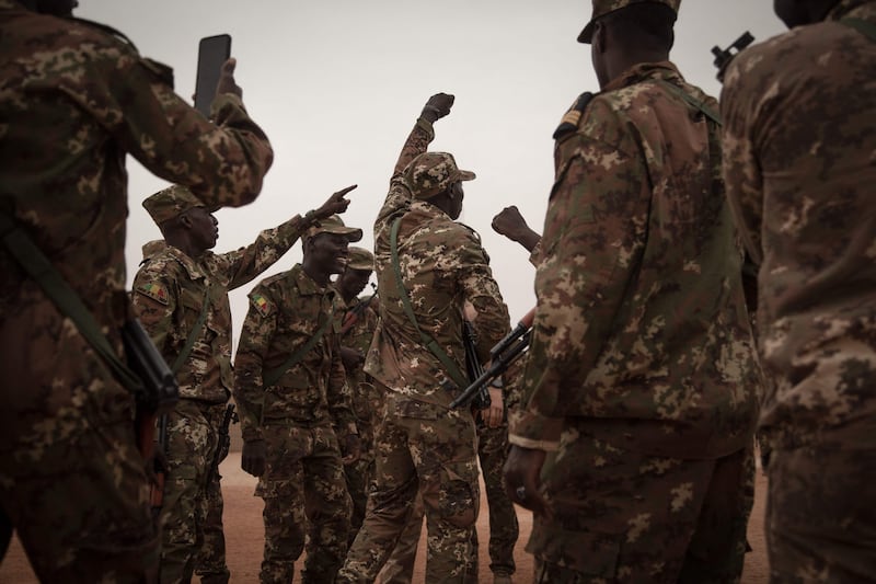 Malian soldiers dance after the handover of a military base by the French army in Timbuktu. AFP