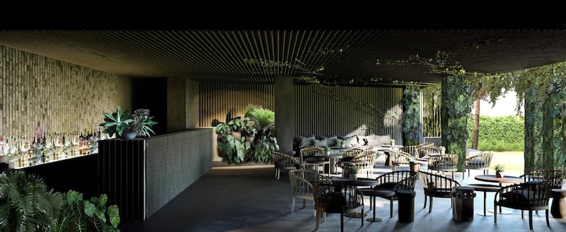 The Baan Ta Bar & Lounge is a moody black bar that looks out to a lush green riverside landscape. Photo: Supplied 
