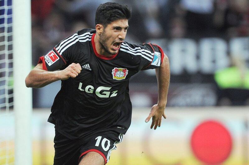 Bayer Leverkusen 2-1 Augsburg. Emre Can netted the winner in the 83rd minute as Leverkusen, like Dortmund, earned three points and kept behind Bayern by one. Marius Becker / EPA