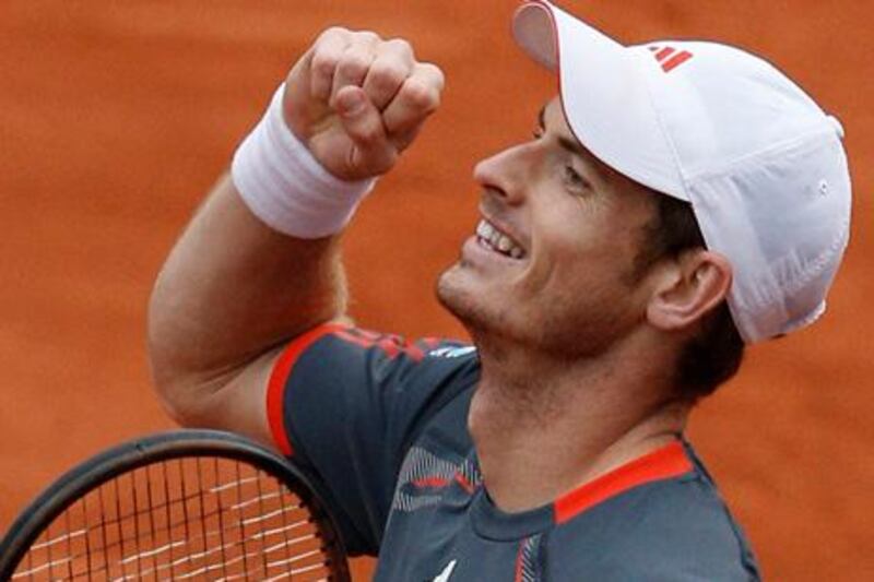 Andy Murray of Britain celebrates reaching the quarter finals after winning his fourth round match against Richard Gasquet of France at the French Open tennis tournament in Roland Garros stadium in Paris, Monday June 4, 2012. Murray won in four sets 1-6, 6-4, 6-1, 6-2. (AP Photo/Christophe Ena)