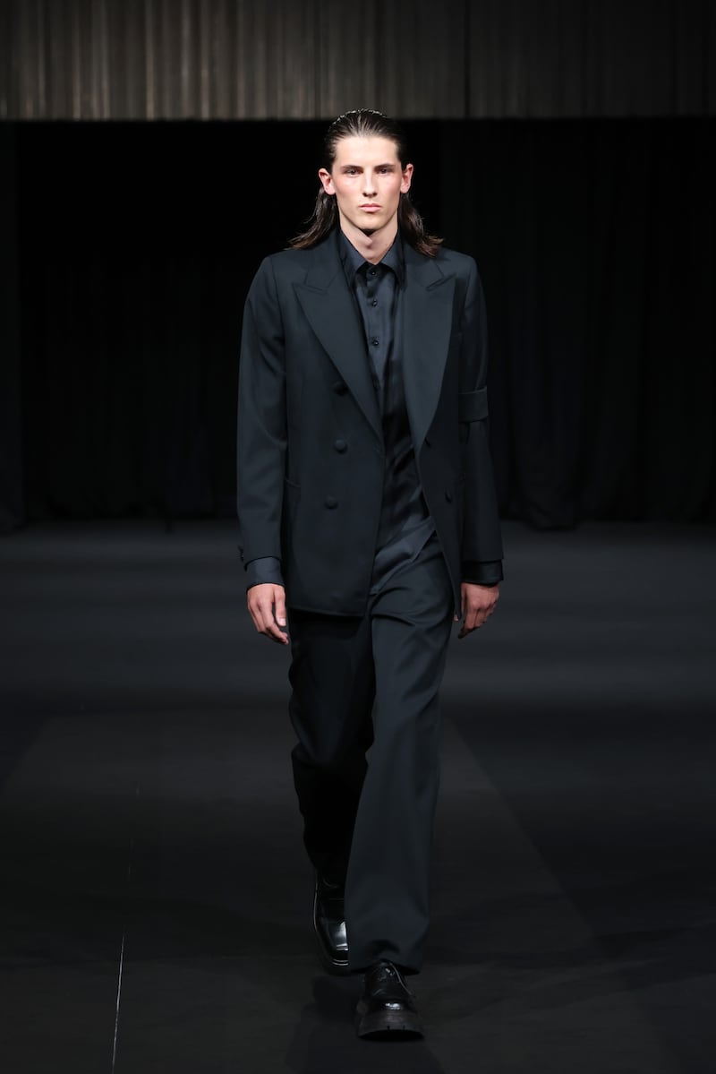 Daniel W Fletcher's show led a minute's silence, when it opened the pre-event evening on Thursday. It was followed with a first look at a mourning suit, with black armband. Getty