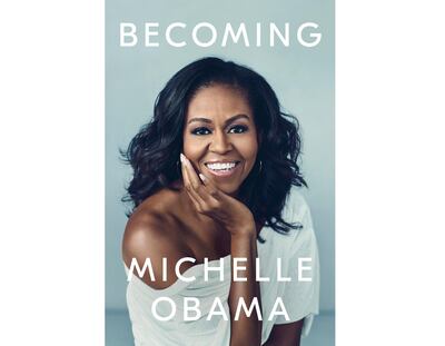 This cover image released by Crown shows "Becoming," by Michelle Obama. Crown Publishing told The Associated Press on Friday that the former first ladyâ€™s memoir had sold more than 725,000 copies after its first day of publication. â€œBecomingâ€ came out Tuesday, the same day Obama launched a national book tour. (Crown via AP)