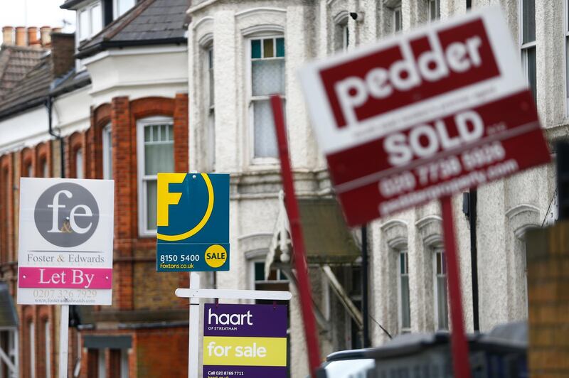 Estate agents boards are lined up outside houses in south London June 3, 2014. Britain's house prices rose at their fastest annual pace in nearly seven years last month and signs of bottlenecks in the construction sector underscored the upward pressures on the market, surveys showed on Tuesday. House price growth picked up to an annual pace of 11.1 percent in May, mortgage lender Nationwide said, fanning concerns that the property market could be overheating.  REUTERS/Andrew Winning   (BRITAIN - Tags: POLITICS BUSINESS REAL ESTATE) - RTR3S0I0