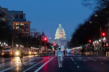 People make their way near the capitol ahead of U.S. President-elect Joe Biden's inauguration, in Washington, U.S., January 15, 2021. REUTERS/Eduardo Munoz