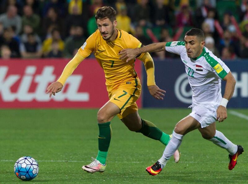 Australia's Mathew Leckie, left, vies for the ball with Iraq's Ali Abbas during a World Cup 2018 football qualifier match in Perth last week. Tony Ashby / AFP