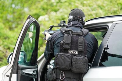 EXETER, ENGLAND - MAY 21: Police officers demonstrate armed stop and arrest techniques on a driver during a demonstration organised by Devon And Cornwall Police to illustrate the skills they may have to draw upon on order to police the forthcoming G7 Summit in Cornwall, on May 21, 2021 in Exeter, England. A wide variety of specially trained police officers will be ready to support their colleagues depending on the activities of protesters, activists and others who may seek to cause public disruption during the event. (Photo by Hugh Hastings/Getty Images)