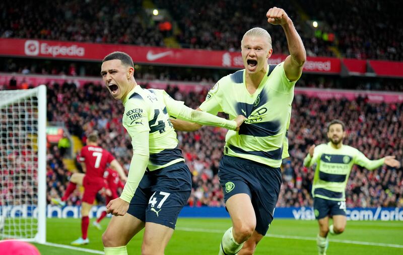 Manchester City's Phil Foden, left, celebrates with Erling Haaland after scoring a goal that was disallowed after a VAR review. AP