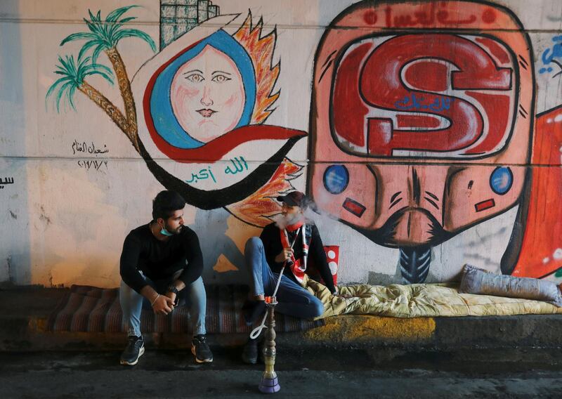 A demonstrator smokes a water pipe  during an ongoing anti-government protests. Reuters