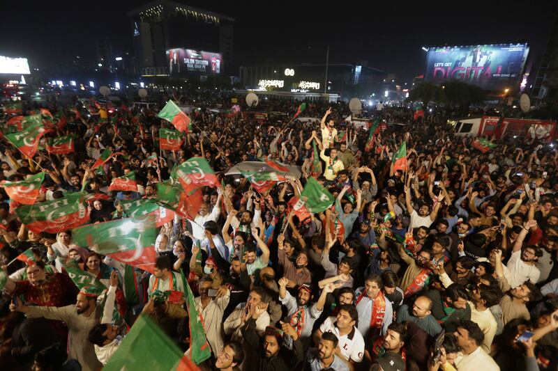 The rally in Lahore drew large crowds of Mr Khan's supporters. AP