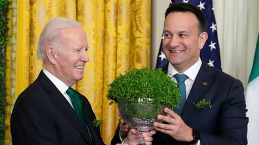 US President Joe Biden and Ireland's Prime Minister Leo Varadkar pictured at a White House St Patrick's Day reception on March 17 last year. Pictures of Mr Varadkar handing over a glass bowl of shamrocks to Mr Biden this year will emerge while the US-backed war in Gaza rages on. AP