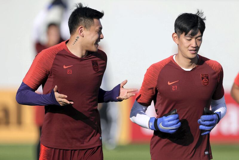 Abu Dhabi, United Arab Emirates - January 03, 2019: Wang Da Lei (L) and Yan Jun Ling (R) of China train before the start of the Asian Cup 2019. Thursday, January 3rd, 2019 in Al Wahda Academy, Abu Dhabi. Chris Whiteoak/The National