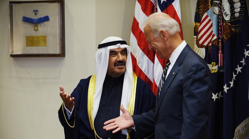 US Vice President Joe Biden (R) reaches out to shake hands with Kuwait's prime minister Sheikh Nasser Al-Mohammed Al-Ahmed Al-Jaber Al-Sabah while posing for photos September 29, 2011 ahead of a meeting in the Roosevelt Room of the White House in Washington, DC. AFP PHOTO/Mandel NGAN (Photo by MANDEL NGAN / AFP)