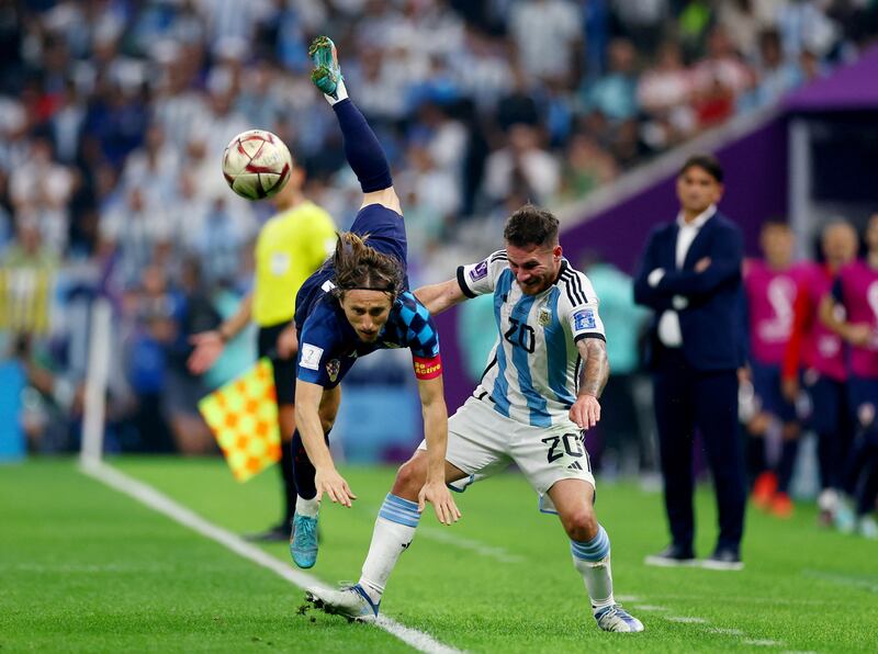 Croatia's Luka Modric in action with Argentina's Alexis Mac Allister. Reuters