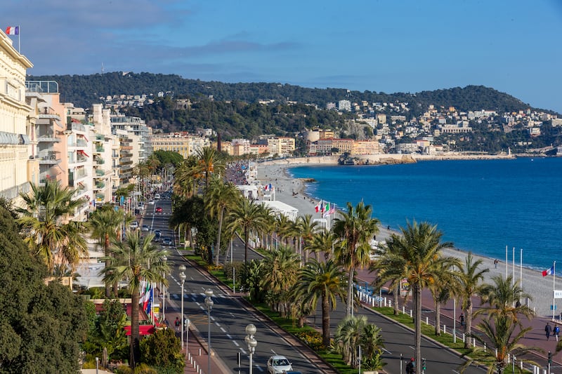 Palm trees flank the promenade which back on to Nice's pebble-strewn beaches. Photo: Nice Tourism
