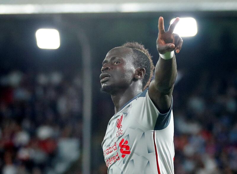 Sadio Mane, centre, celebrates after scoring his team's second goal. Reuters