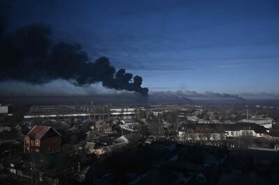 Black smoke rises from an airport in Chuguyev in the first hours of the war on February 24. AFP 