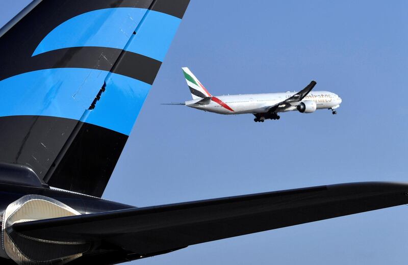 An Emirates Airline Boeing 777 aircraft takes off from the Felix Houphouet-Boigny Airport in Abidjan on November 28, 2017. / AFP PHOTO / ISSOUF SANOGO