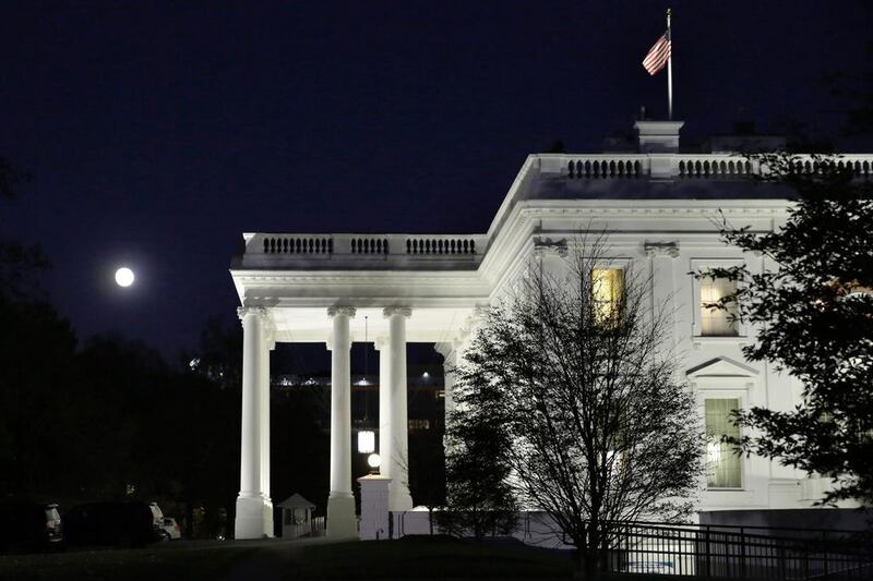 The moon rises over the White House in Washington on November 13, 2016. AFP