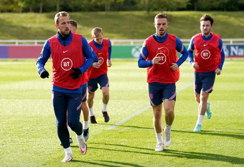 England's Harry Kane, left, and Jordan Henderson, right. PA