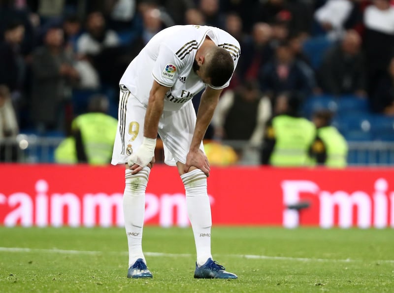Real Madrid's Karim Benzema looks dejected after the match. Reuters