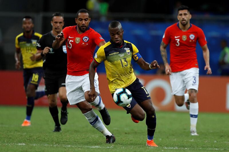 Ecuador forward Enner Valencia dribbles past Chile's Jean Beausejour. EPA
