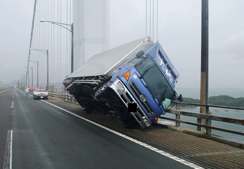 A truck sitting at an angle after being blown over by strong winds caused by Typhoon Jebi on the Seto Ohashi bridge in Sakade, Kagawa prefecture. AFP