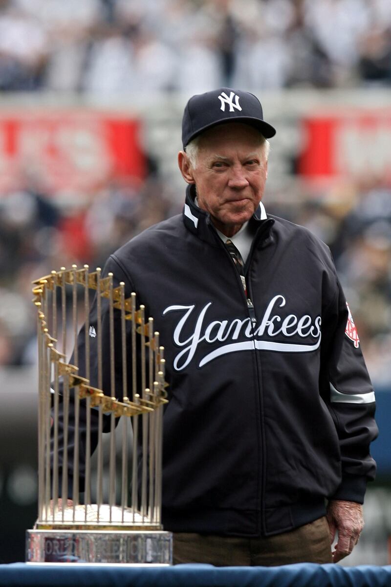 NEW YORK - APRIL 13:  New York Yankee's legend and Baseball Hall of Famer Whitey Ford stands on the field for the presentation of the New York Yankees with their 2009 World Series rings prior to playing against the New York Yankees of the Los Angeles Angels of Anaheim during the Yankees home opener at Yankee Stadium on April 13, 2010 in the Bronx borough of New York City.  (Photo by Chris Trotman/Getty Images)