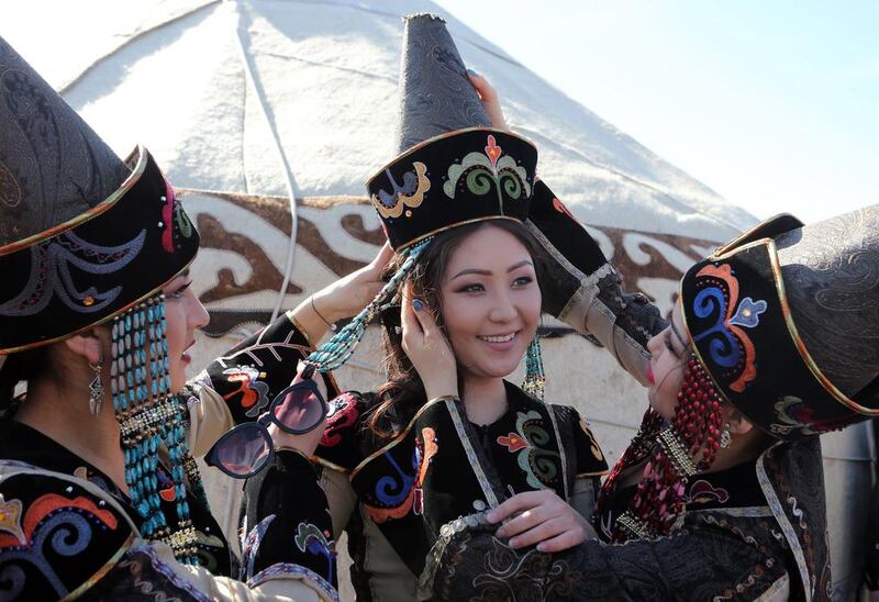 Kyrgyz women pose for the photographer dressed in national attire during Nooruz celebrations in Bishkek, Kyrgyzstan. Nooruz is traditionally celebrated by Central Asian people as a New Year holiday. Igor Kovalenko / EPA