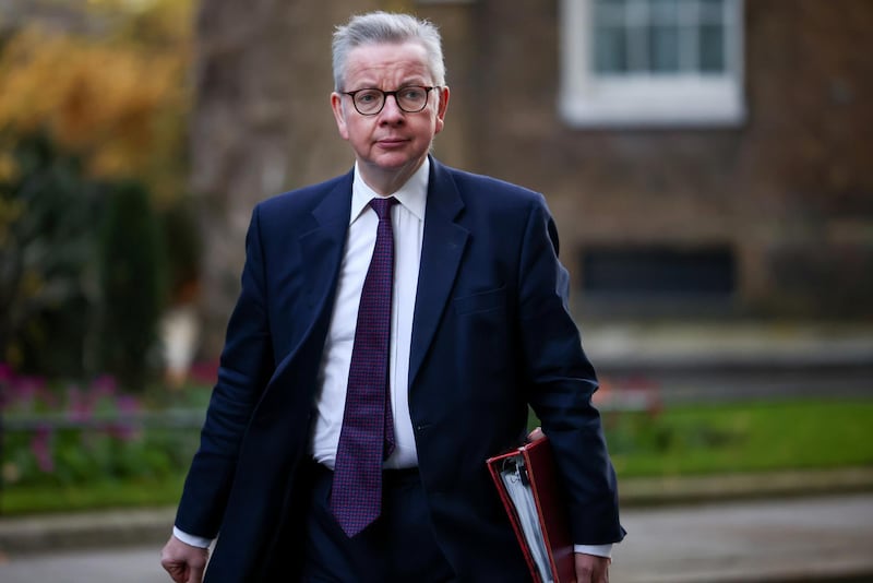 FILE PHOTO: Britain's Chancellor of the Duchy of Lancaster Michael Gove arrives to attend a Cabinet meeting at the Foreign and Commonwealth Office (FCO) in London, Britain December 1, 2020. REUTERS/Henry Nicholls/File Photo