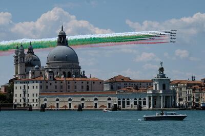 The aerobatic demonstration team of the Italian Air Force, the Frecce Tricolori ("Tricolor Arrows"), fly over the Basilica of Saint Mary of Health as they perform as part of a nationwide tour to show unity and solidarity following the outbreak of the coronavirus disease (COVID-19), in Venice, Italy, May 29, 2020. REUTERS/Manuel Silvestri     TPX IMAGES OF THE DAY