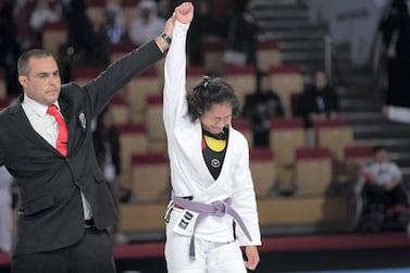  Annie Ramirez has her armed raised after winning the female purple belt 55-kilogram final. Reem Mohammed / The National