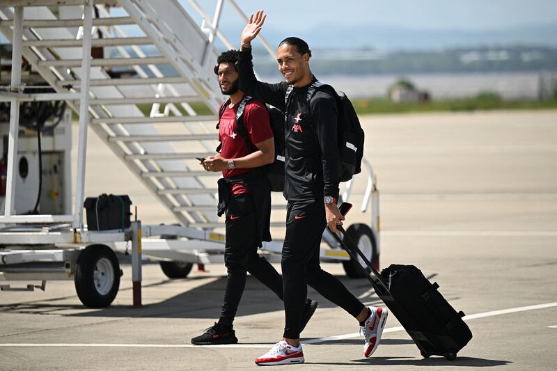 Joe Gomez, left, and Virgil van Dijk leave for Paris. AFP