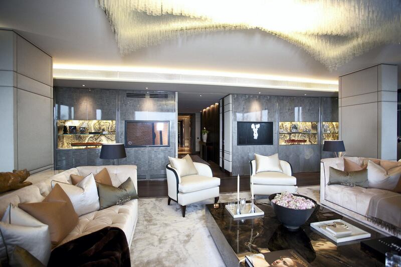 Mandatory Credit: Photo by REX/Shutterstock (1321782l)
A reception room of one of the luxury flats in One Hyde Park
Luxury apartment complex One Hyde Park built by Christian and Nick Candy, London, Britain - 05 Apr 2011
One Hyde Park has quickly become one of the most desirable - not to mention expensive - addresses on the planet. On average properties in the luxury London development cost ����6,000 per square foot, compared to a city-wide average of ����200 to ����300. The complex was designed by Millennium Dome architect Lord Rogers and is the brainchild of property tycoon brothers Nick and Christian Candy. In total there are 86 apartments, as well as a private cinema, a 21m swimming pool, saunas, a gym, a golf simulator, a wine cellar and a valet and a concierge. The cheapest one-bedroom flat available is believed to cost around ����6.75m, while larger one reportedly go for around ����30m. Even the annual service charge tops ����100,000 a year. The exclusive address is over the road from Harvey Nichols and just a stone's throw from Kensington Palace. It is also next door to the Mandarin Oriental hotel and a special team of 60 employees is on hand to provide room service to those who live at One Hyde Park.
