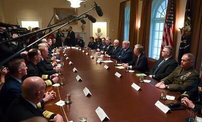 President Donald Trump, fourth from right, speaks in the Cabinet Room of the White House in Washington, Monday, April 9, 2018, at the start of a meeting with military leaders. Trump is flanked by Vice President Mike Pence, left, and national security adviser John Bolton, right. (AP Photo/Susan Walsh)