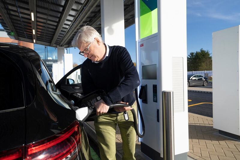 A customer charges his car at the new service station. Courtesy Gridserve