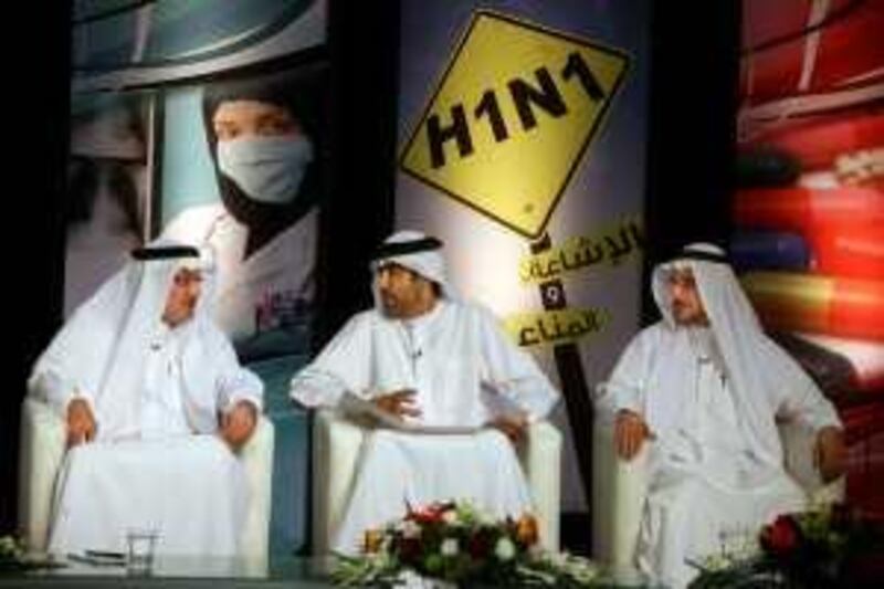 Abu Dhabi, United Arab Emirates --- October 2, 2009 --- Humaid al Qutami (from left to right), Hanif Hassan and Dr Mahmoud M. Fikri were among the panelists participating in a Al Emarat TV station Swine Flu broadcast on October 2, 2009. ( Delores Johnson / The National )  ***NOTE- they wrote down there own names and some of the writing is a bit hard to read so I am giving the notesheet with their had written names to the editor.*** *** Local Caption ***  dj_02oct09_H1N1 day_005.jpg