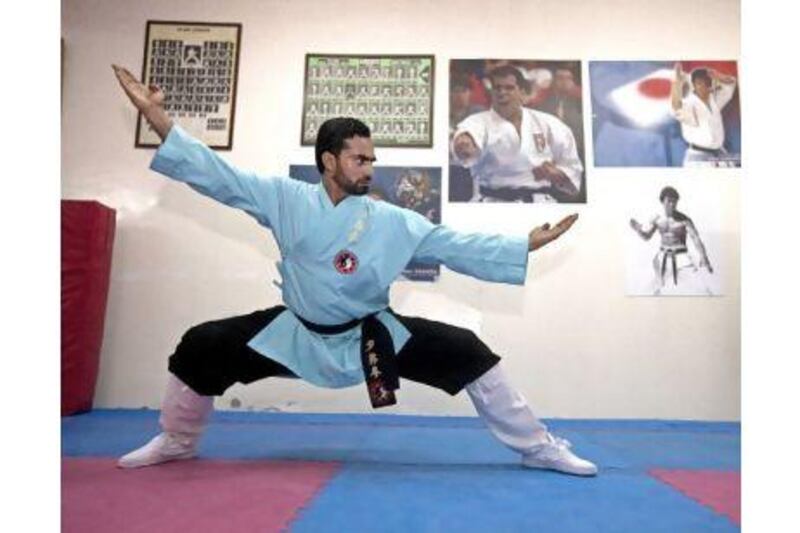 Mujeeb Rahman demonstrates a fighting stance during his class at the Kodokan Martial Arts Club in Ajman.