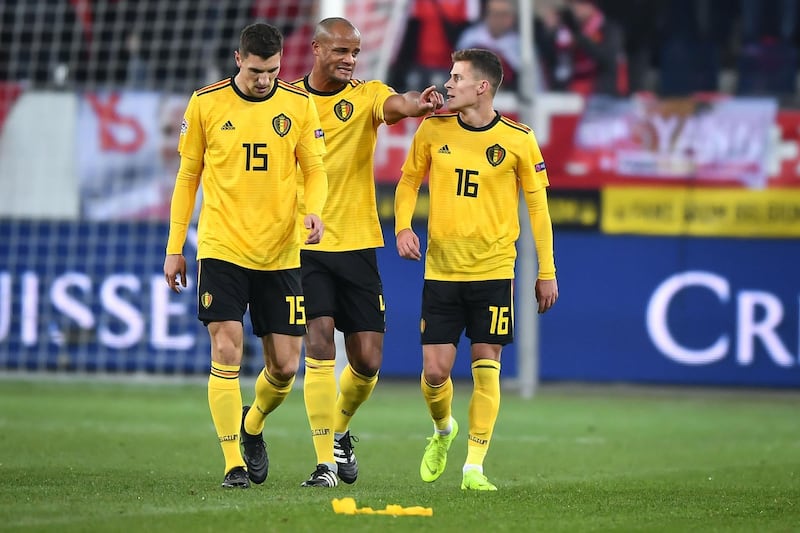 (From L) Belgium's defender Thomas Meunier, defender Vincent Kompany and forward Thorgan Hazard react during the UEFA Nations League, league A, group 2 football match between Switzerland and Belgium at the Swissporarena stadium in Lucerne, on November 18, 2018.  / AFP / Fabrice COFFRINI
