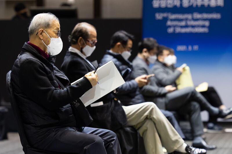 Attendees socially distance during the Samsung Electronics Co. annual general meeting at the Suwon Convention Centre in Suwon, South Korea. Bloomberg