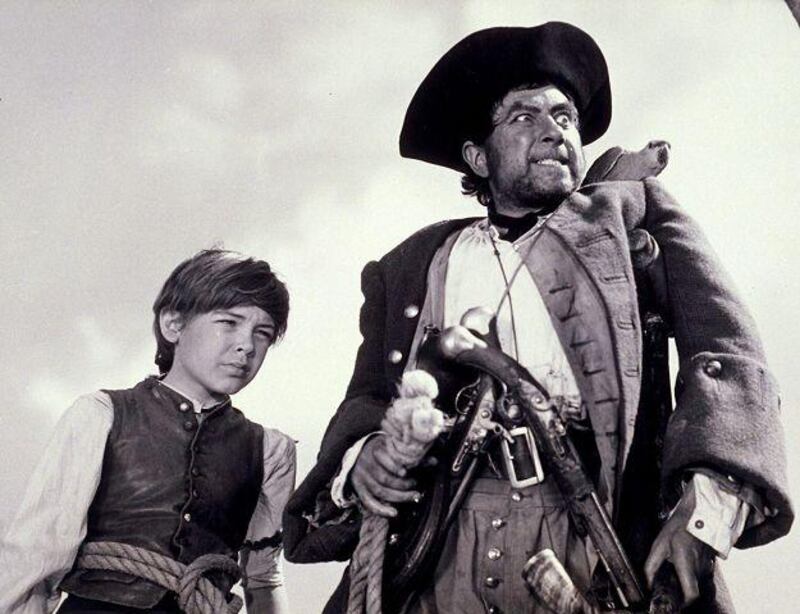 Bobby Driscoll, left, and Robert Newton in the 1950 film adaptation of Treasure Island. Rex Features