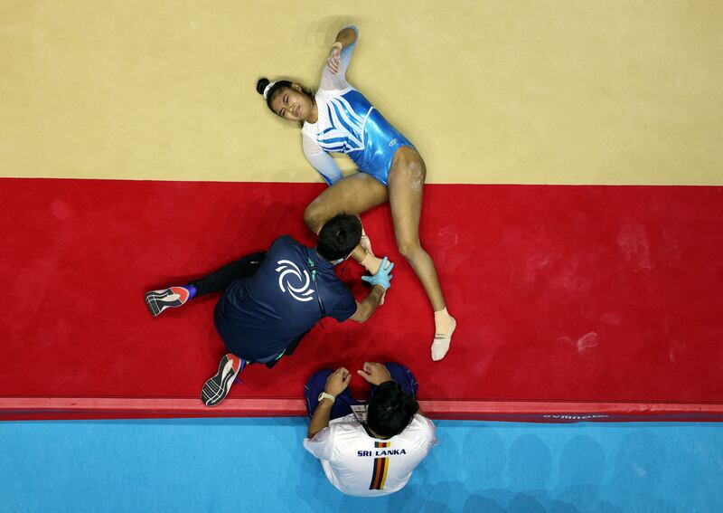Sri Lanka's Milka Gehani receives medical attention after sustaining an injury at the Gymnastics World Championships in Liverpool, Britain. Reuters
