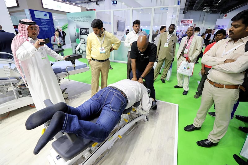 Dubai, United Arab Emirates - Reporter: Dan Sanderson: Hakim Hassan from the Finland Osteopathy clinic performs physio. Thousands of people gather for the Arab Health conference. Monday, January 27th, 2020. World trade centre, Dubai. Chris Whiteoak / The National
