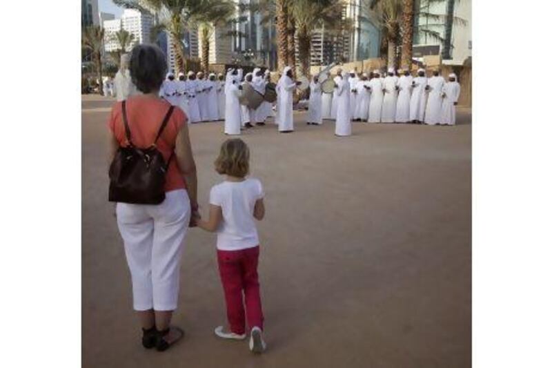 Spectators watch traditional Emirati song and dance performances at the festival this week. Sammy Dallal / The National