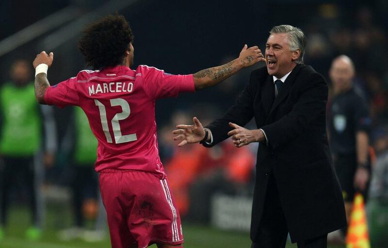Marcelo rushes to celebrate his goal with Real Madrid coach Carlo Ancelotti. Patrik Stollarz / Getty