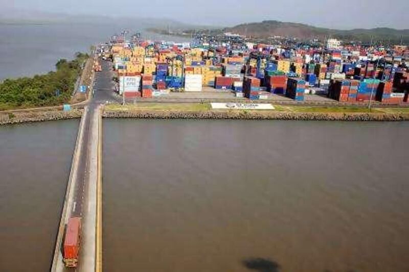 An aerial view shows shipping containers stacked at DP World Ltd.'s Nhava Sheva port in Navi Mumbai, India, on Monday, May 17, 2010. DP World Ltd. said as much as $1 billion may be invested in the first Indian port able to handle the largest container ships as the company tries to challenge Colombo's grip on India's maritime trade with Europe and China. Photographer: Adeel Halim/Bloomberg

 *** Local Caption ***  676133.jpg