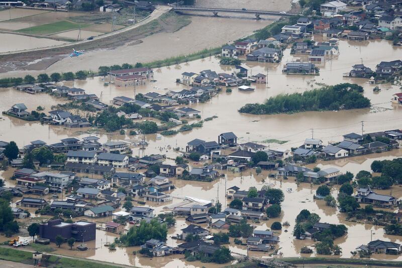 Record rainfall triggered massive floods and landslides, forcing authorities to issue evacuation advisories for more than 200,000 residents. AFP