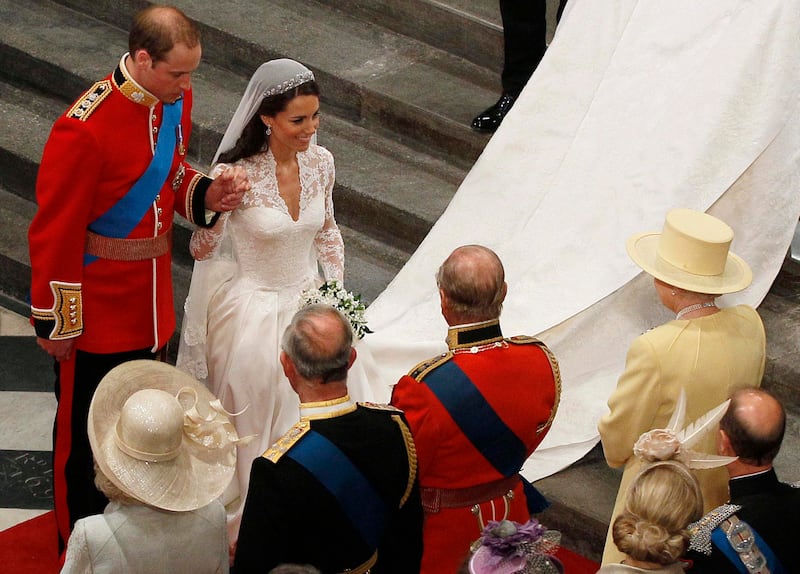 Prince William holds the hand of his bride, Kate, as they walk down the aisle and greet Queen Elizabeth II inside Westminster Abbey on the couple's wedding day on April 29, 2011, in London, England. Getty Images