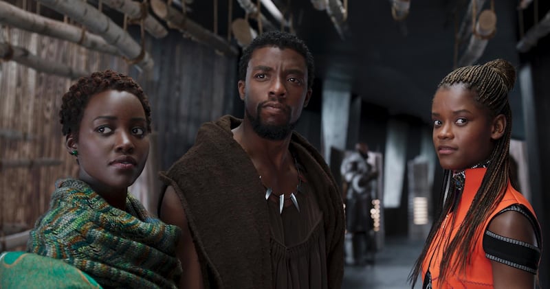 This image released by Disney shows Lupita Nyong'o, from left, Chadwick Boseman and Letitia Wright in a scene from "Black Panther." The cast was nominated for a SAG Award for best ensemble. The SAG Awards will be held Jan. 27 and broadcast live by TNT and TBS. This year's show will honor Alan Alda with the Screen Actors Guild Life Achievement Award. (Disney via AP)