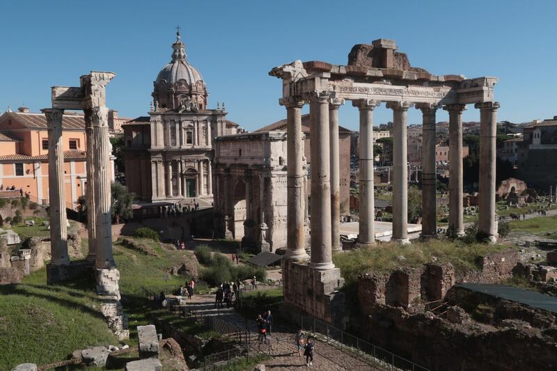 ROME, ITALY - OCTOBER 28:  Visitors walk among ancient ruins at the Roman Forum on October 28, 2016 in Rome, Italy. Rome is among Europe's major tourist destinations.  (Photo by Sean Gallup/Getty Images)